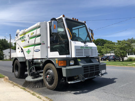 Global R4 Regenerative Air Street Sweeper in a residential neighborhood